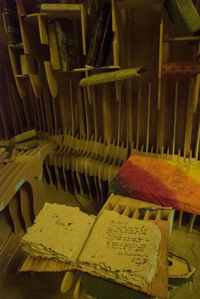 Handmade books resting on a table inside the library.